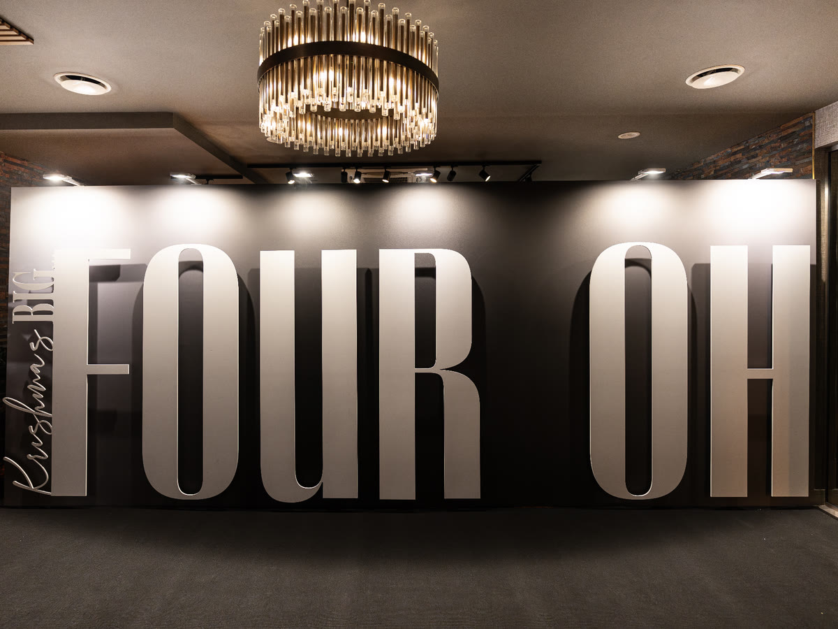 FOUR OH 40th birthday backdrop with giant cut letters, printed by Print Station